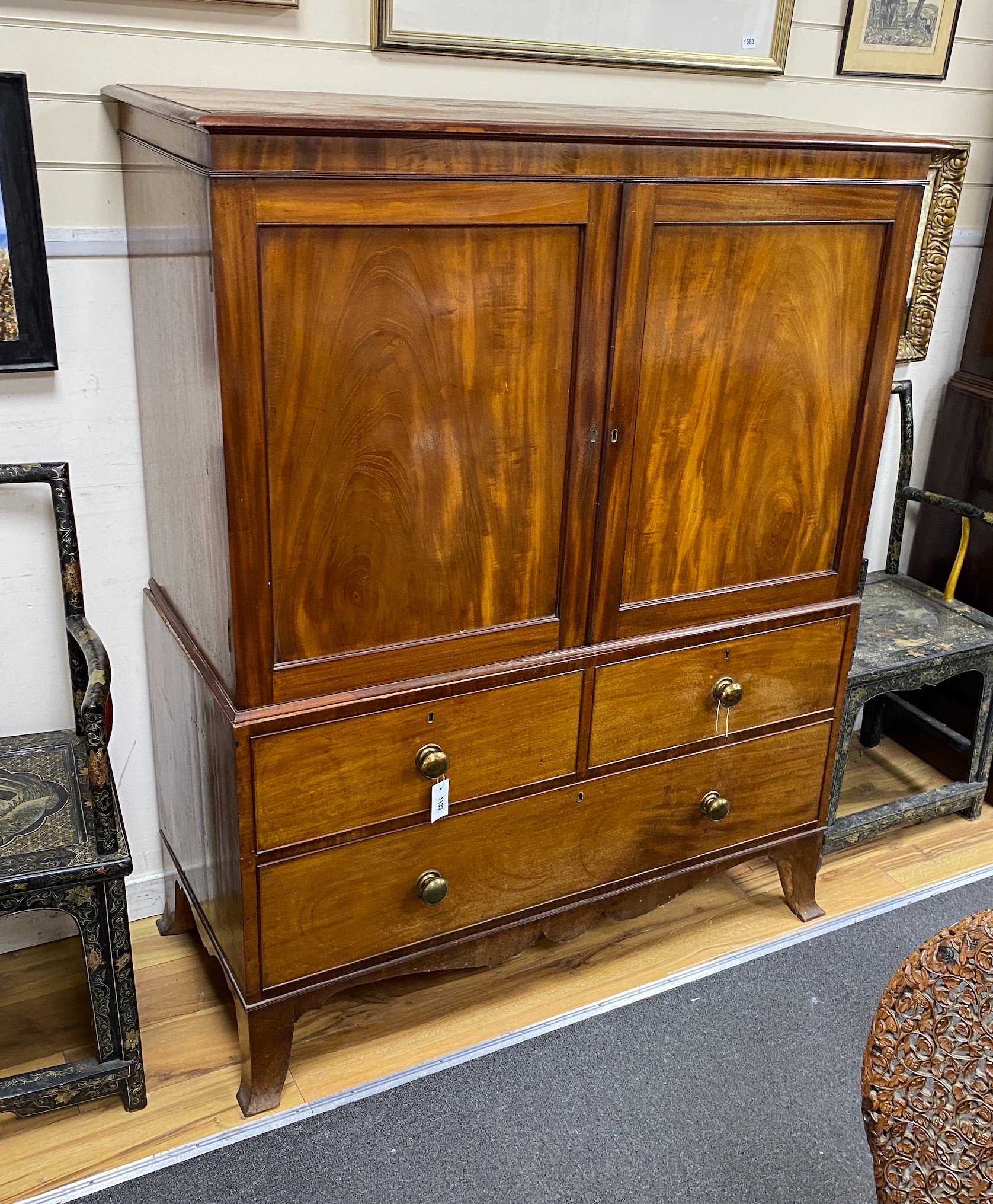 A George III mahogany linen press, now a hanging cupboard, width 124cm depth 57cm height 156cm